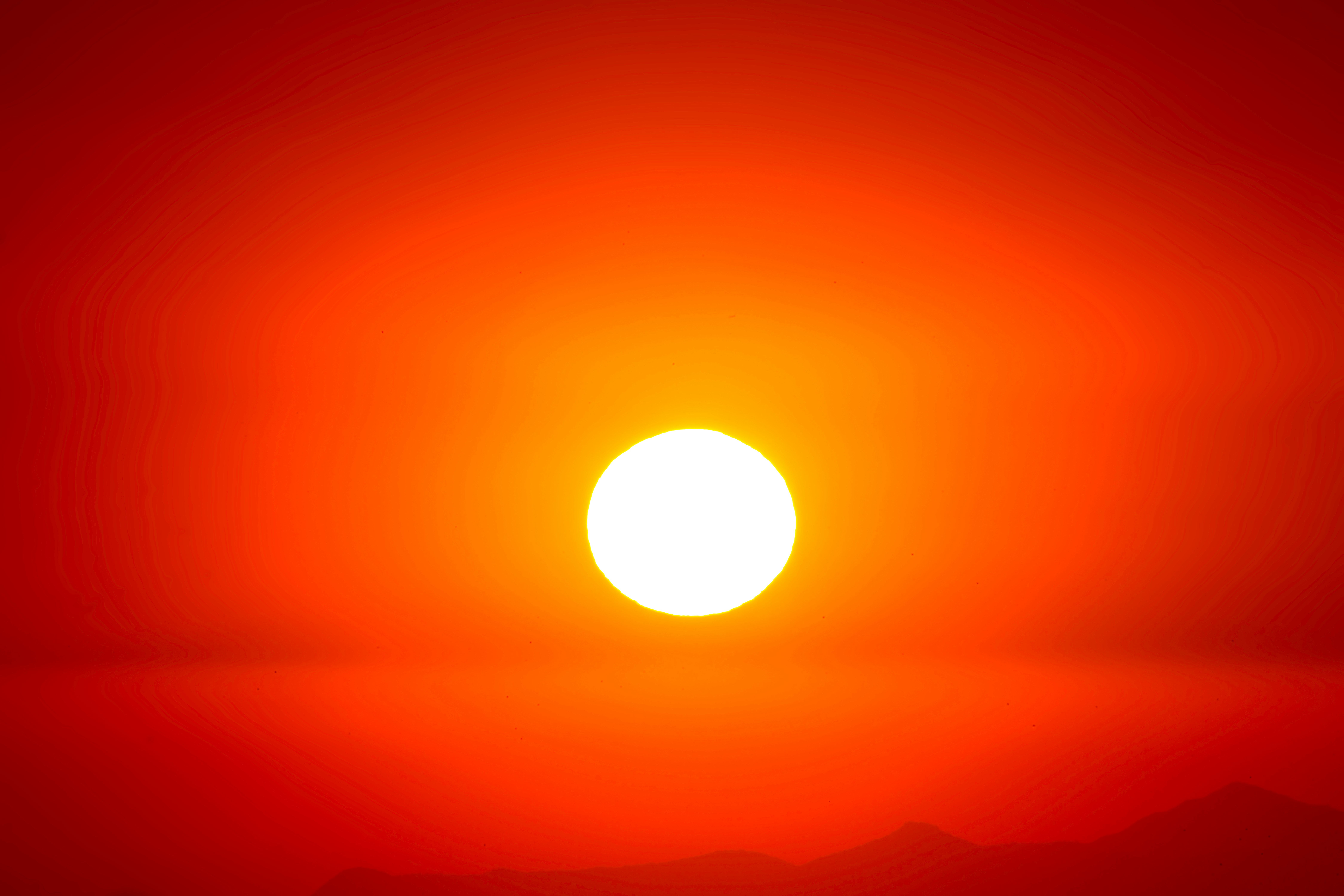 The sun in a bright hot orange sky