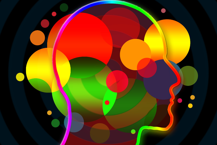 A silhoutte of a head in side profile against a black background. There are bold, brightly coloured circles of varying size covering the image. 